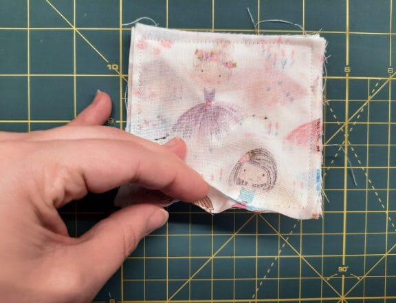 Sewing a corner bookmark: use the turning gap to flip the whole piece right-side out.