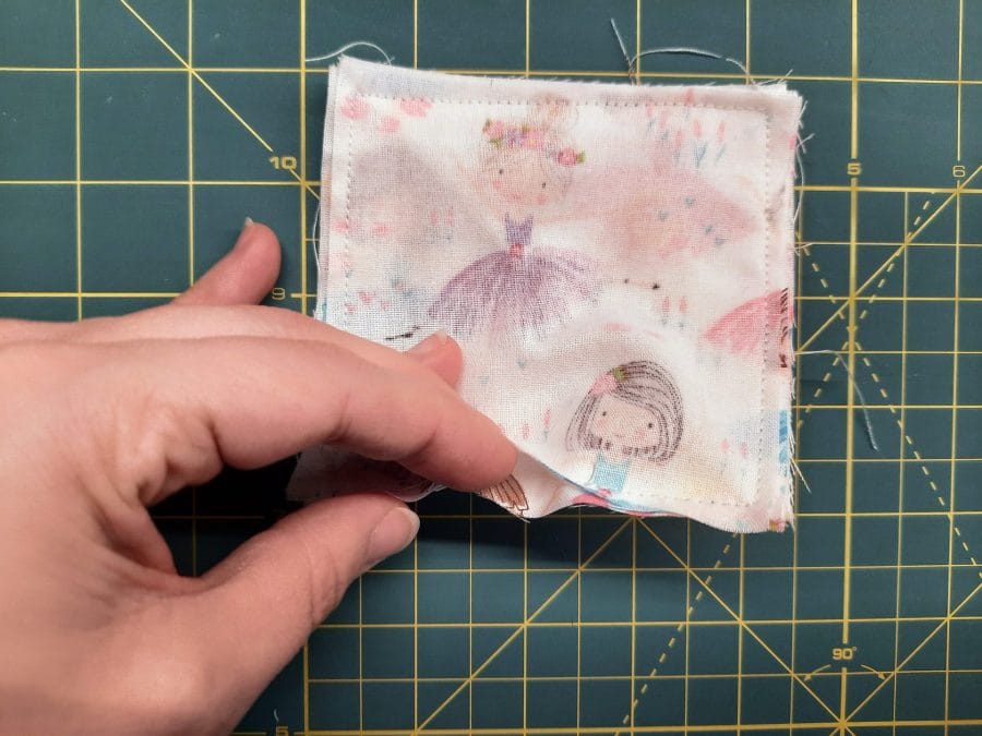 Sewing a corner bookmark: use the turning gap to flip the whole piece right-side out.