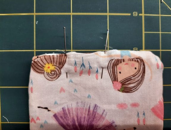 Sewing a corner bookmark: to close the turning gap, sew a narrow topstitch all around the edge, as closed to the edge as possible.