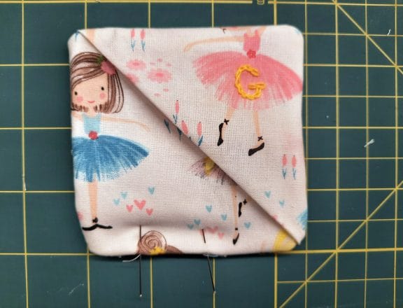 Sewing a corner bookmark: to close the turning gap, sew a narrow topstitch all around the edge, as closed to the edge as possible.