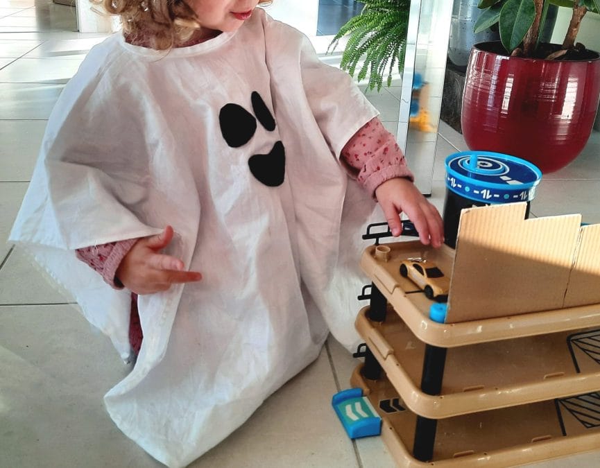 My daughter wearing her ghost costume all around the house
