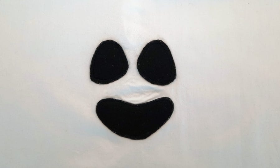 Ghost costume for Halloween: the ghost face cut out of black felt