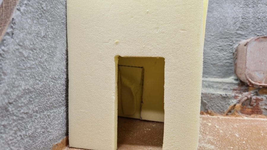 Making a Nativity diorama inside an antique steamer trunk: carving the houses out of foam