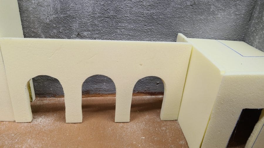 Making a Nativity diorama inside an antique steamer trunk: carving the houses out of foam