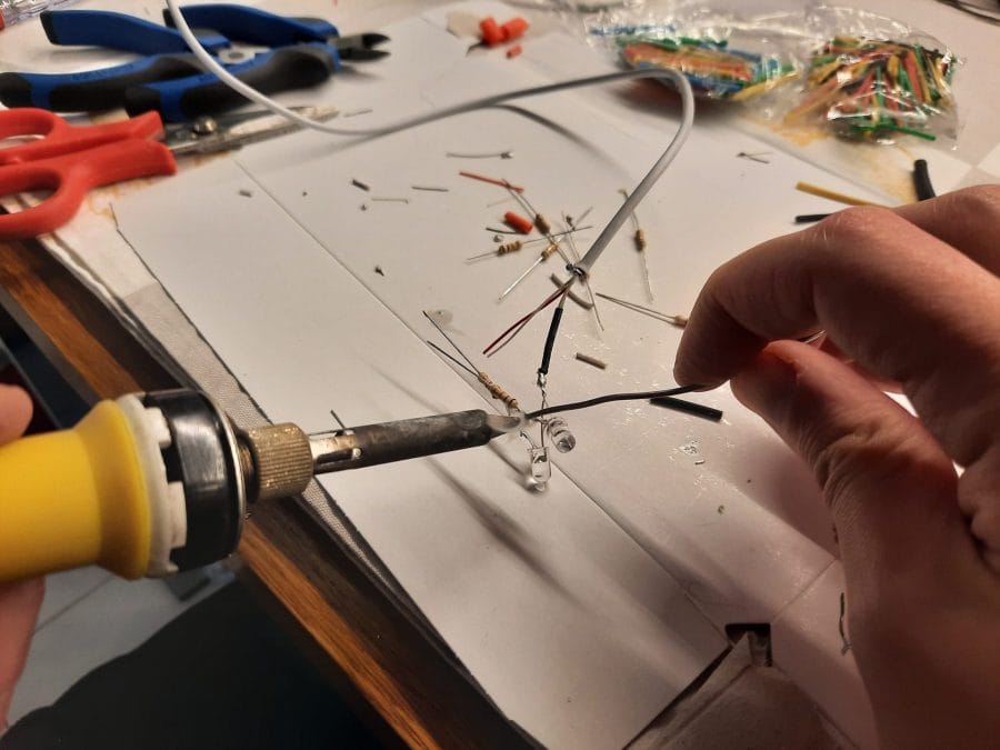 Making a Nativity diorama inside an antique steamer trunk: adding the LED lights to the buildings