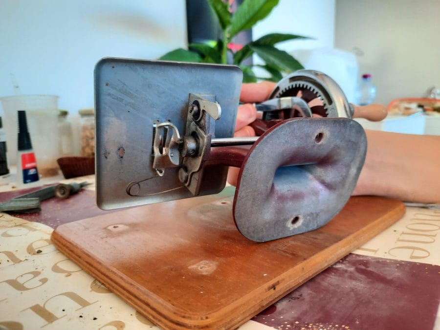 The Essex MK1 miniature sewing machine removed from its wooden base