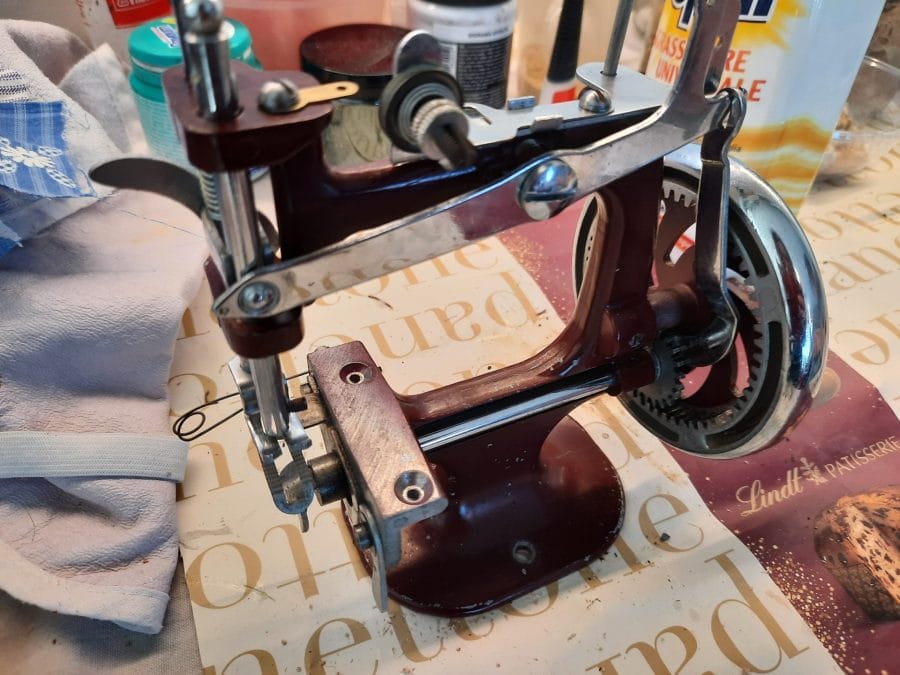 The chain stitch mechanism of my Essex MK1 miniature sewing machine fully accessible after removing the stitch plate
