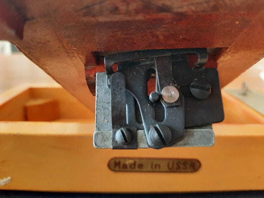 Removing the base from my Orsha sewing machine, I could see the underlying chain stitch mechanism