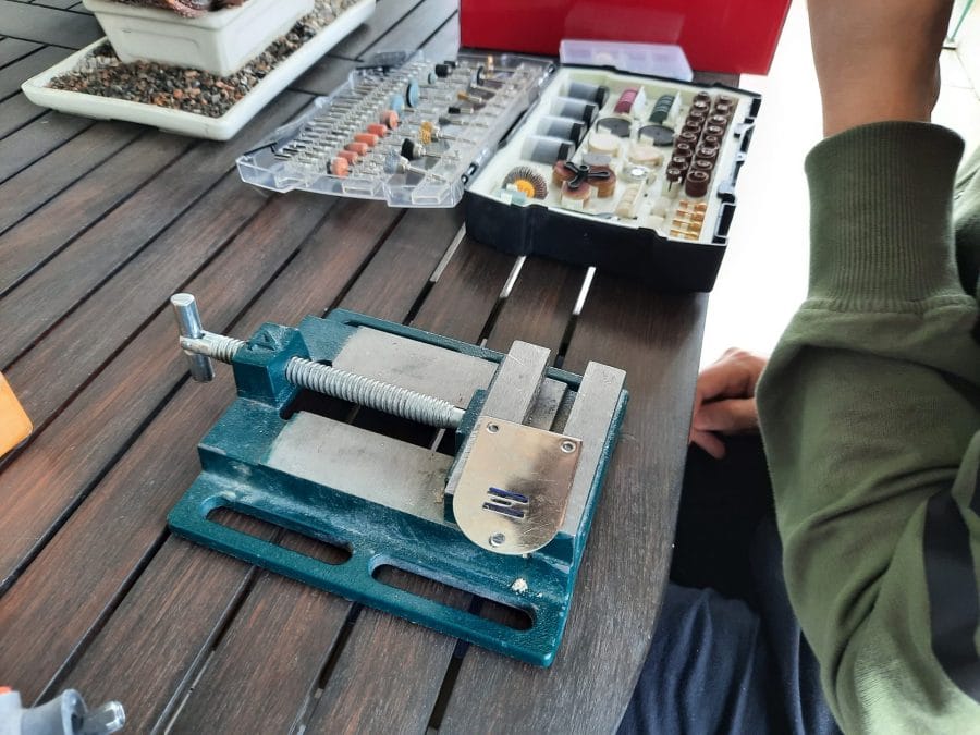 Trying to fix the feed dogs of my Orsha sewing machine by drilling the holes in the needle plate to make them fit