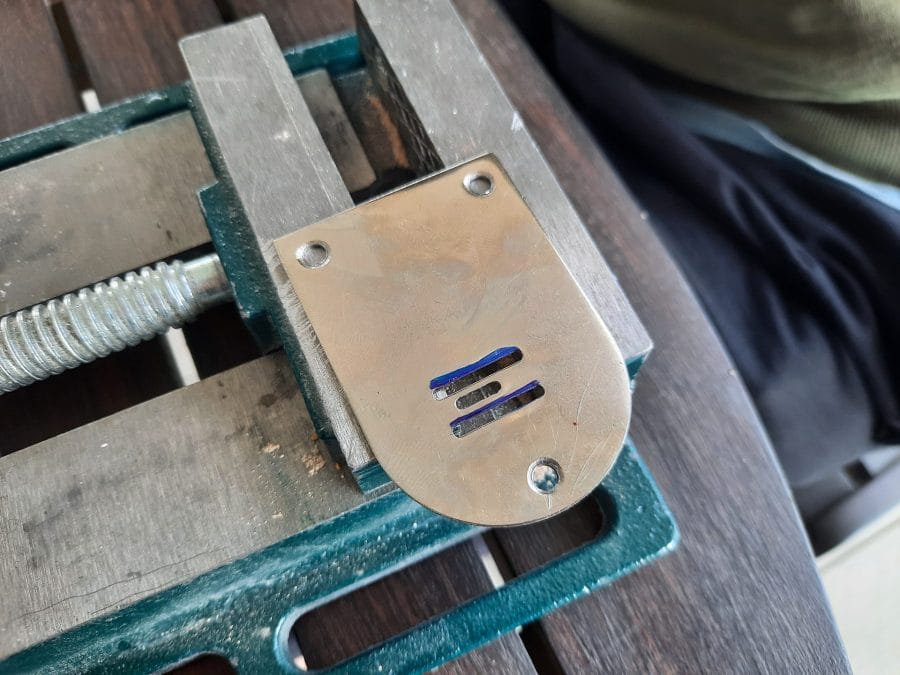 Trying to fix the feed dogs of my Orsha sewing machine by drilling the holes in the needle plate to make them fit