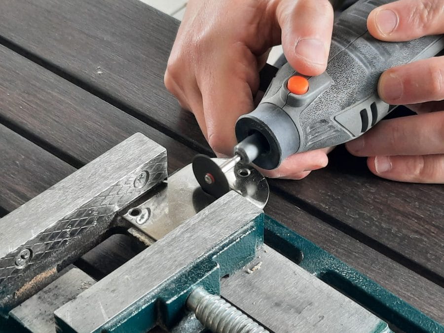 Trying to fix the feed dogs of my Orsha sewing machine by drilling the holes in the needle plate to make them fit