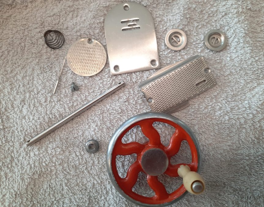 The pieces of the second Orsha sewing machine during the cleaning process