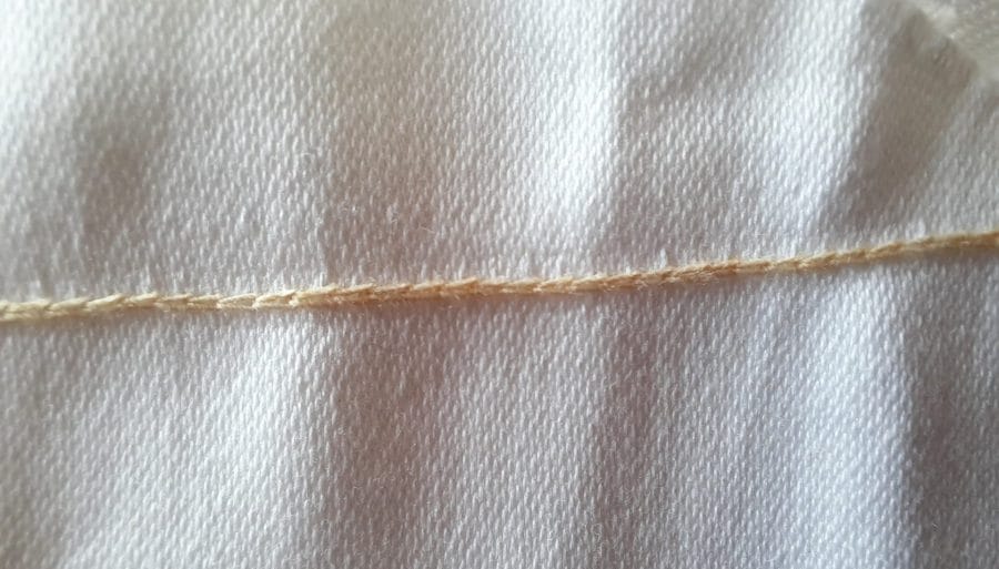 The sewing test with my Orsha toy sewing machine. The back with the signature chain stitch