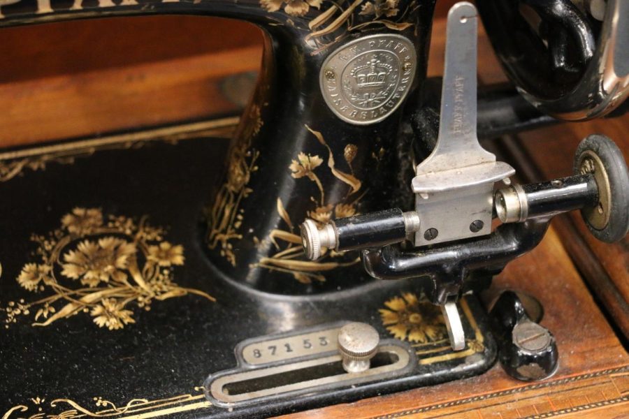 A Pfaff vintage sewing machine with the serial number on a metal plate inset into the bed, below the logo badge