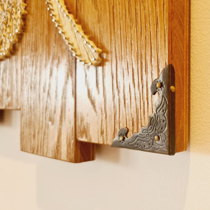 Adding little book cover corners can provide a lovely touch to refinish a string art project