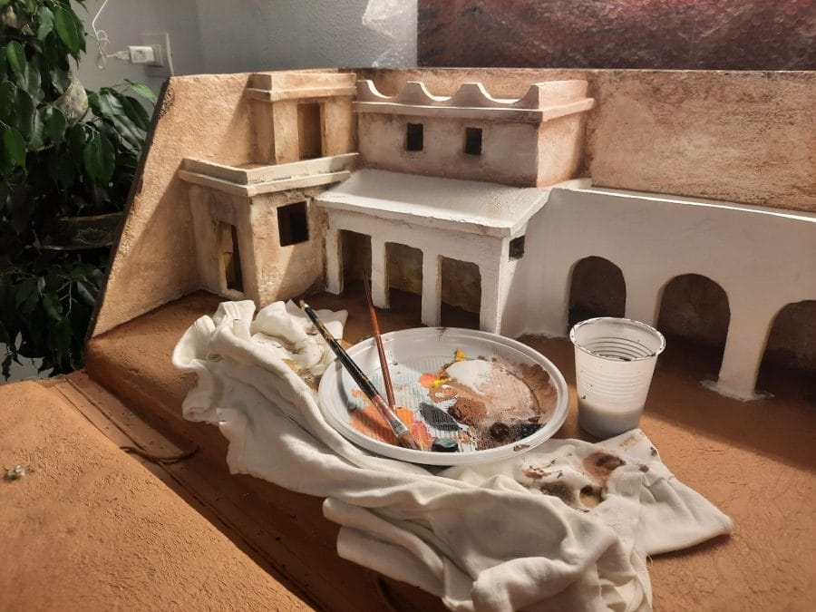 Making a Nativity diorama inside an antique steamer trunk: painting the buildings