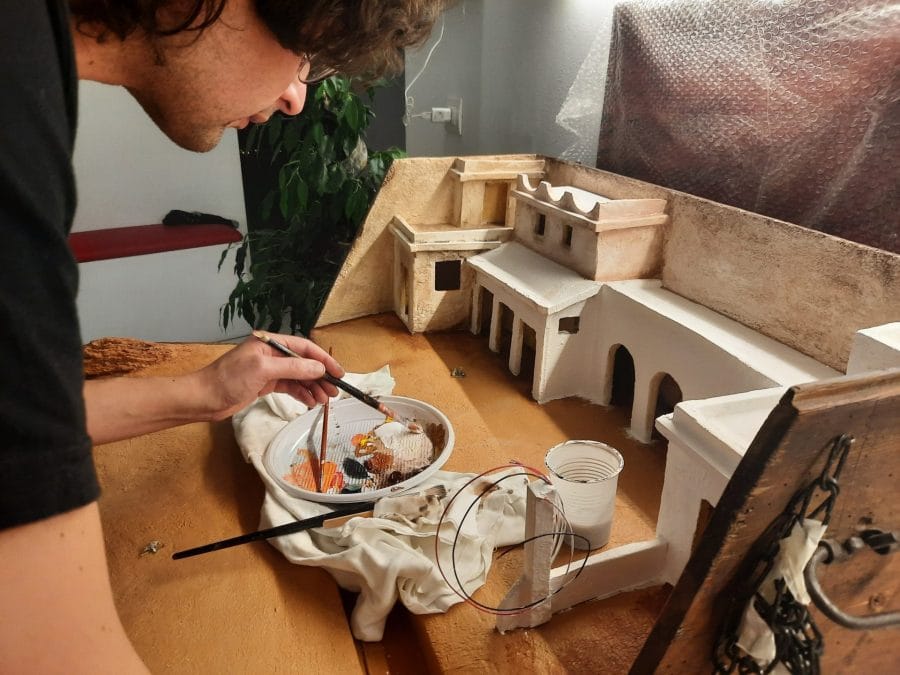 Making a Nativity diorama inside an antique steamer trunk: painting the buildings