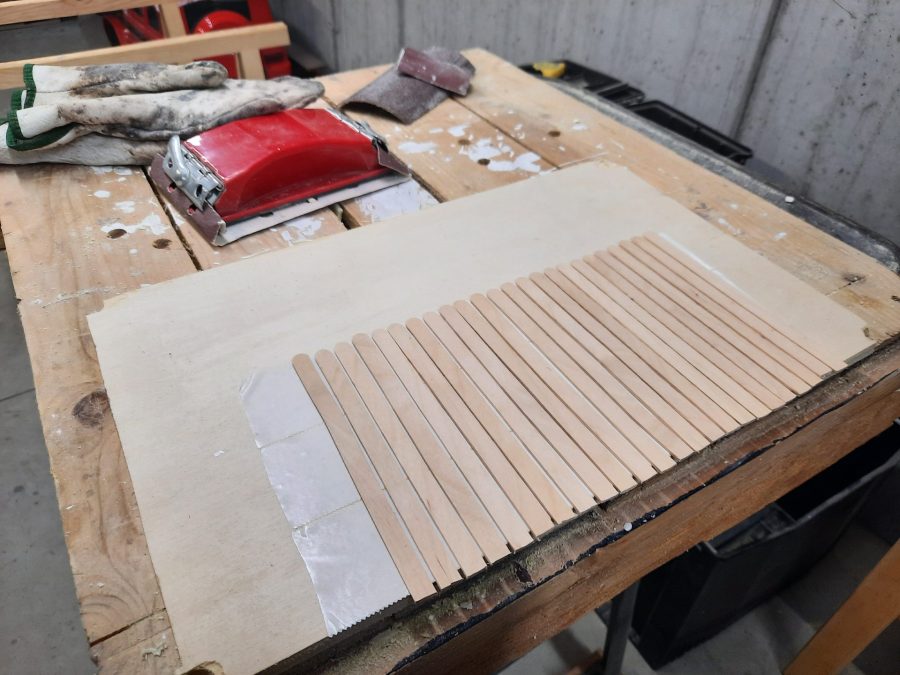Making a Nativity diorama inside an antique steamer trunk: making a wooden roof out of popsicle sticks