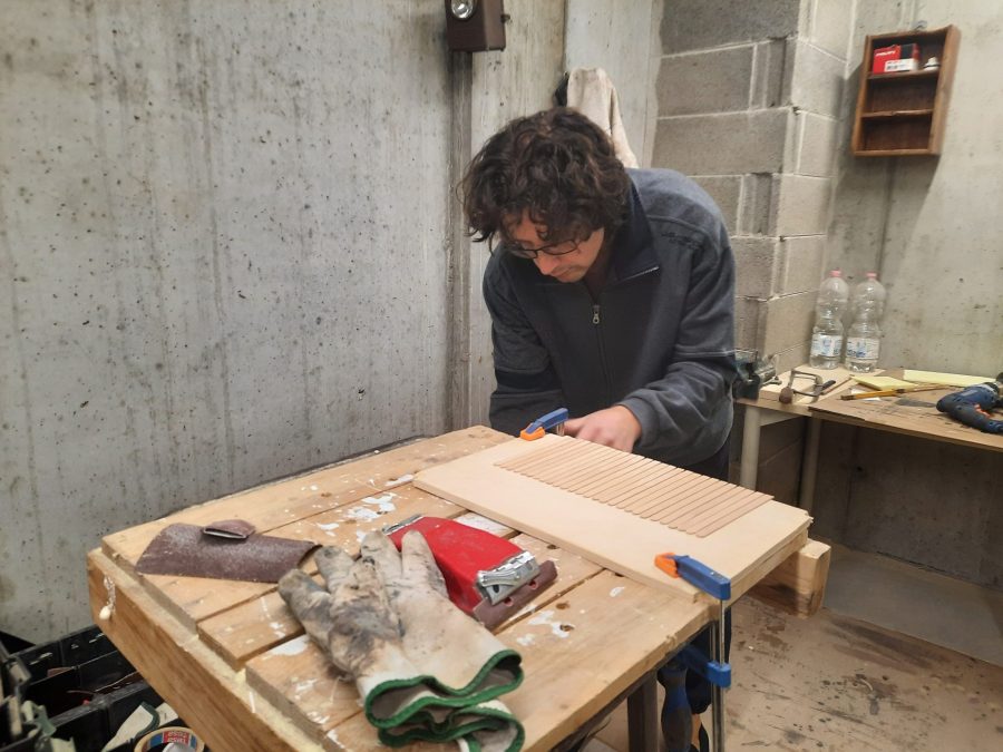 Making a Nativity diorama inside an antique steamer trunk: making a wooden roof out of popsicle sticks