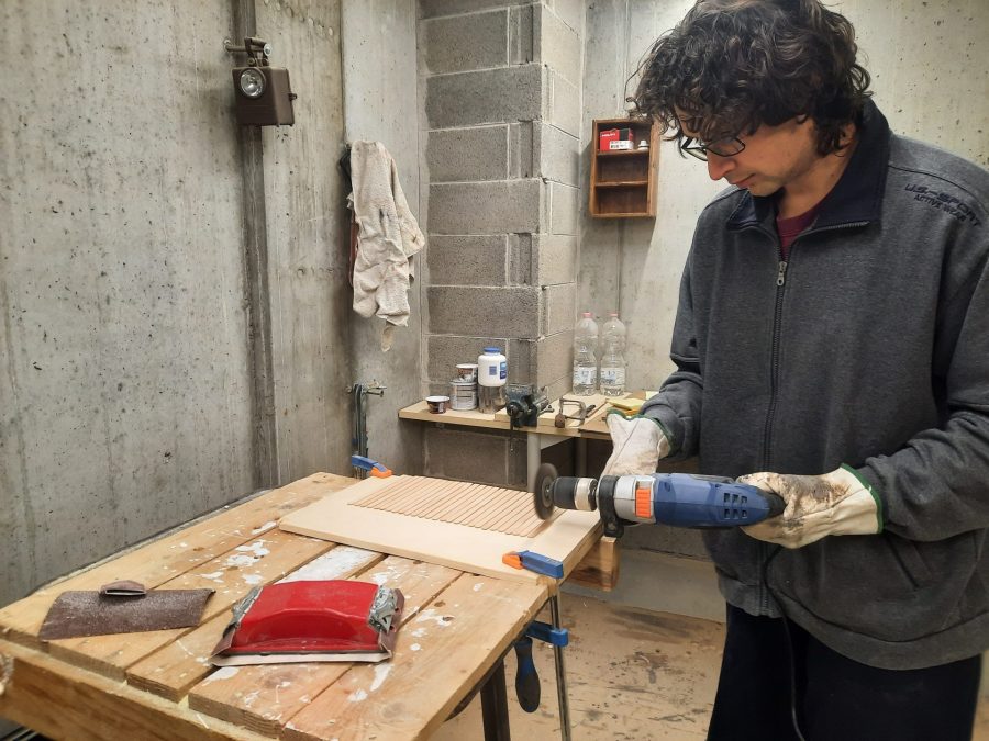 Making a Nativity diorama inside an antique steamer trunk: making a wooden roof out of popsicle sticks