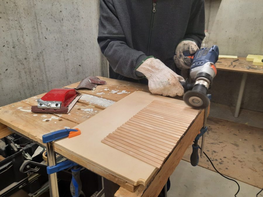 Making a Nativity diorama inside an antique steamer trunk: making a wooden roof out of popsicle sticks