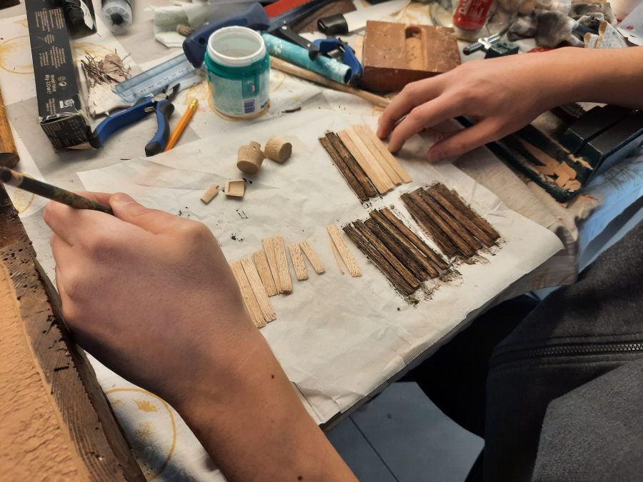 Making a Nativity diorama inside an antique steamer trunk: making a wooden roof out of popsicle sticks
