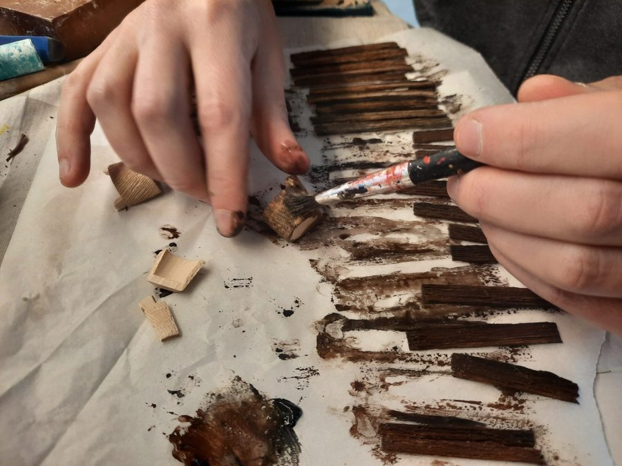 Making a Nativity diorama inside an antique steamer trunk: making a wooden roof out of popsicle sticks