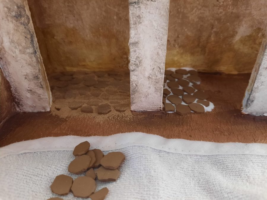Making a Nativity diorama inside an antique steamer trunk: paving the horses stable and the main square's porch
