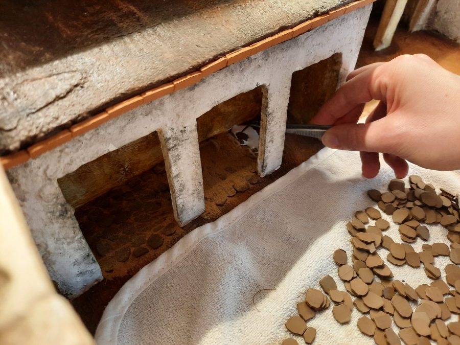 Making a Nativity diorama inside an antique steamer trunk: paving the horses stable and the main square's porch