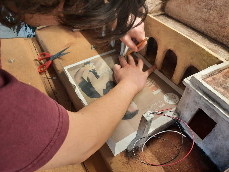 Making a Nativity diorama inside an antique steamer trunk: paving the town square