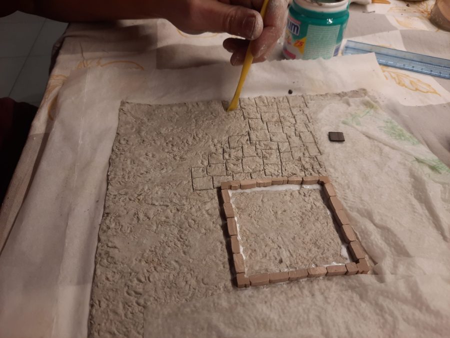 Making a Nativity diorama inside an antique steamer trunk: paving the town square