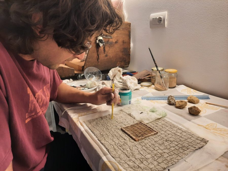 Making a Nativity diorama inside an antique steamer trunk: paving the town square