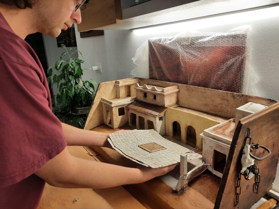Making a Nativity diorama inside an antique steamer trunk: paving the town square