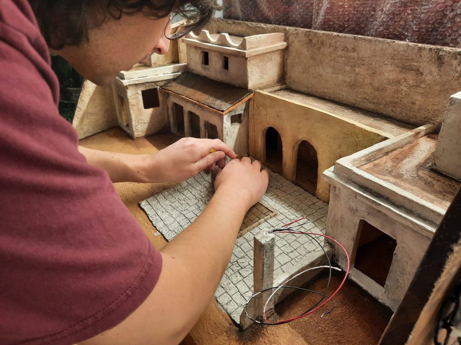 Making a Nativity diorama inside an antique steamer trunk: paving the town square