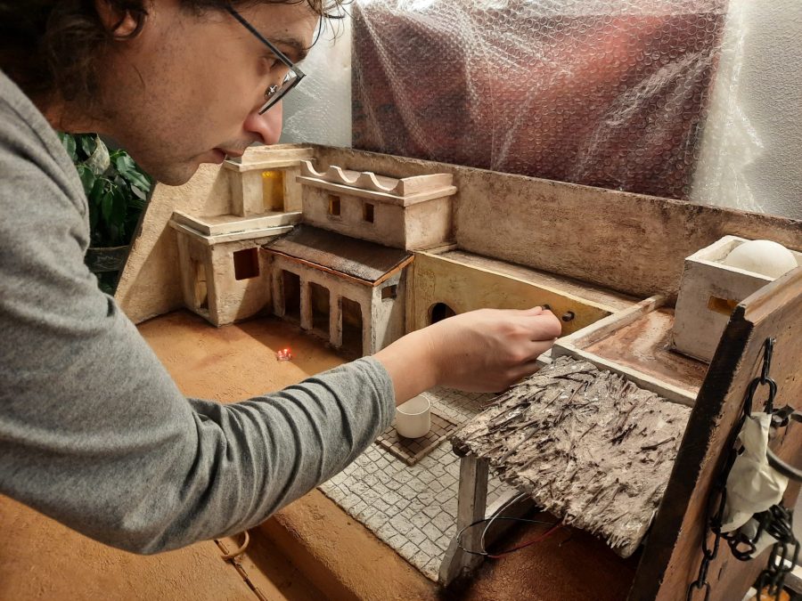 Making a Nativity diorama inside an antique steamer trunk: adding wooden supports to the balcony on top of the porch