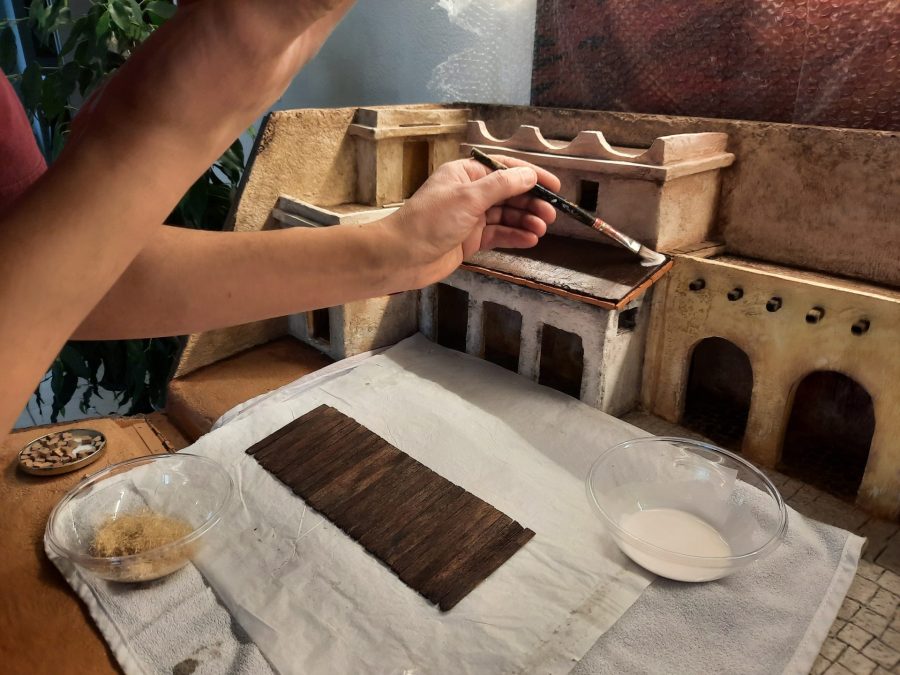 Making a Nativity diorama inside an antique steamer trunk: making a wooden roof out of popsicle sticks