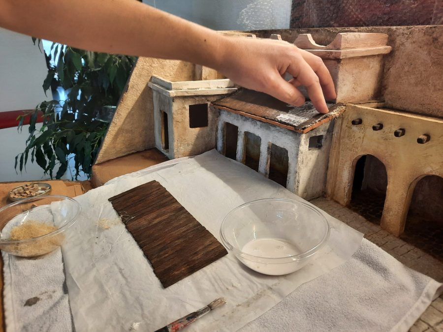 Making a Nativity diorama inside an antique steamer trunk: making a wooden roof out of popsicle sticks
