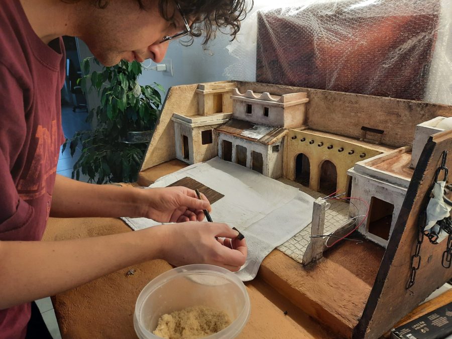 Making a Nativity diorama inside an antique steamer trunk: making a wooden roof out of popsicle sticks