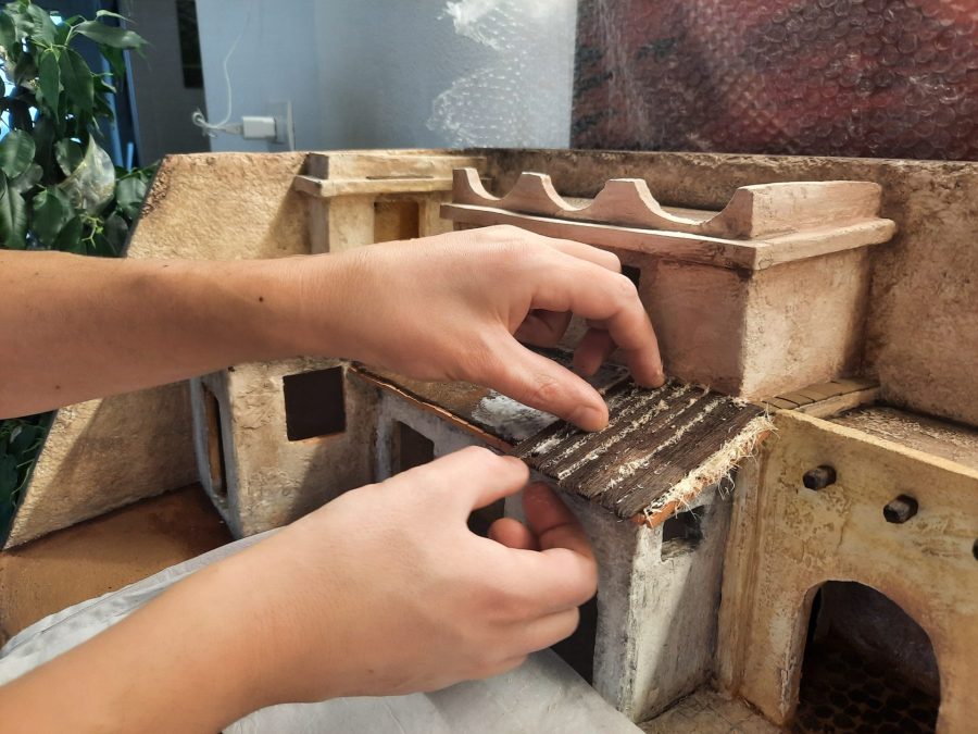 Making a Nativity diorama inside an antique steamer trunk: making a wooden roof out of popsicle sticks