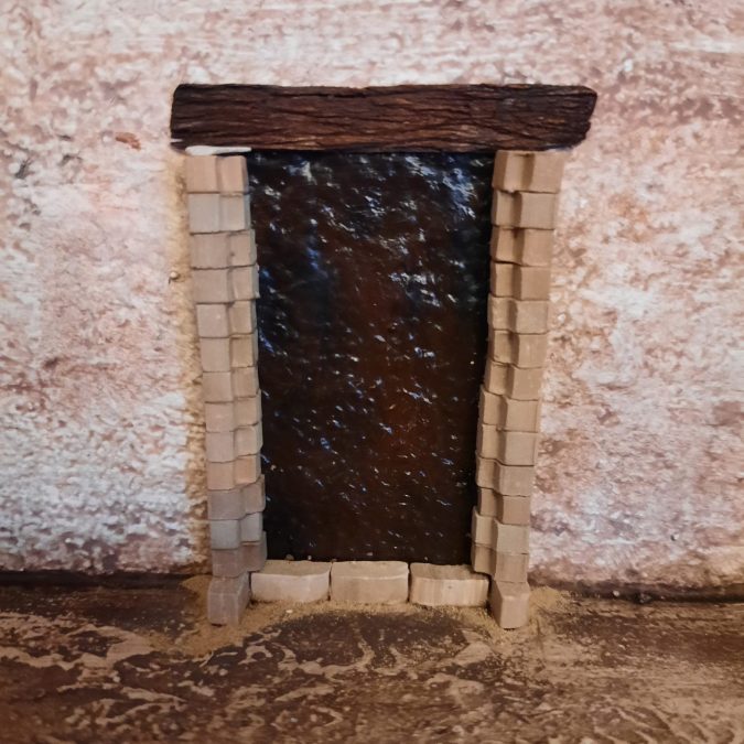 Making a Nativity diorama inside an antique steamer trunk: creating a fake doorway