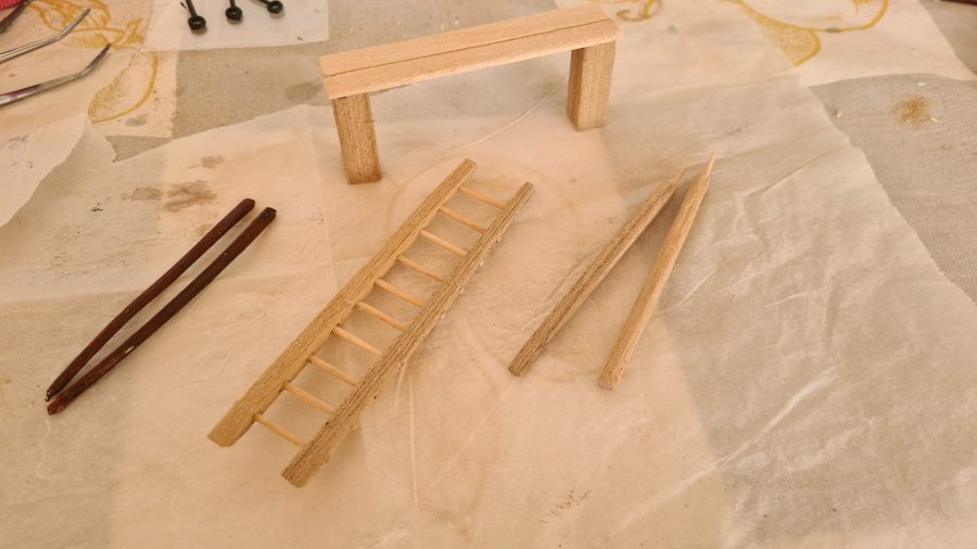 Making a Nativity diorama inside an antique steamer trunk: furnishing the blacksmith's workshop