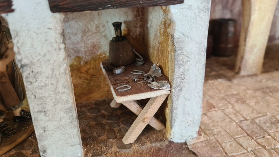 Making a Nativity diorama inside an antique steamer trunk: furnishing the blacksmith's workshop