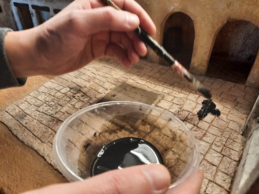 Making a Nativity diorama inside an antique steamer trunk: painting the main square