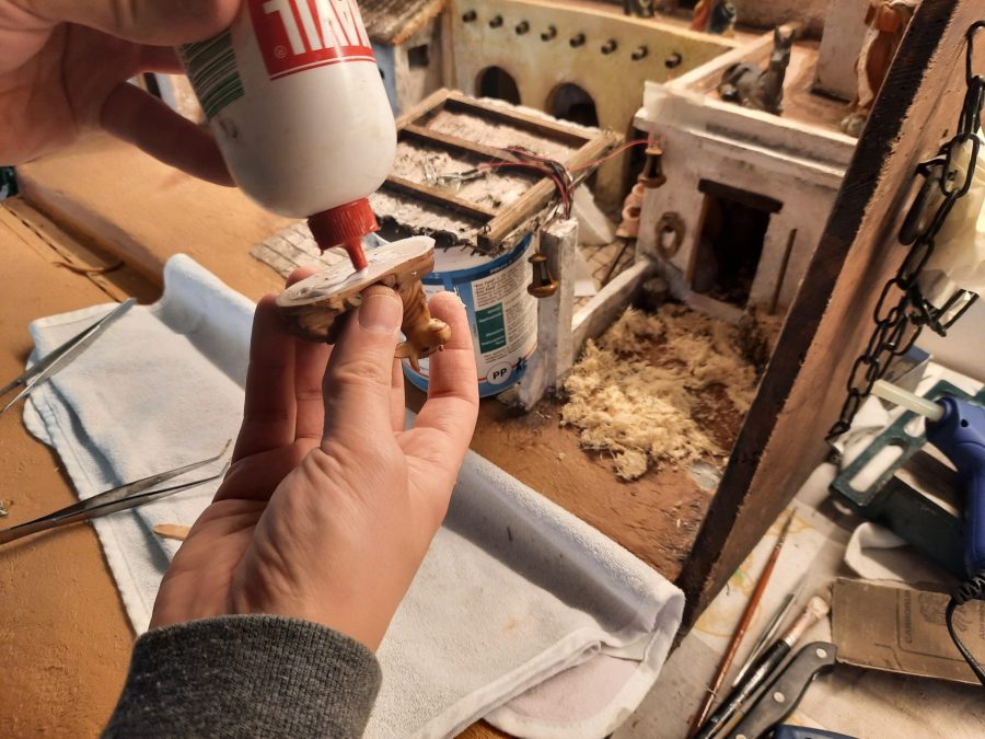 Making a Nativity diorama inside an antique steamer trunk: refining details in the holy stable