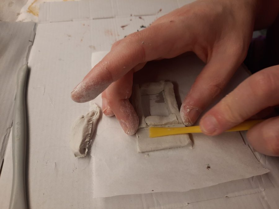 Making a Nativity diorama inside an antique steamer trunk: sculpting the forge