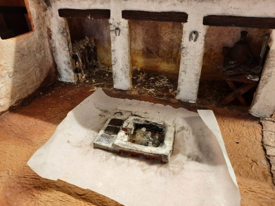 Making a Nativity diorama inside an antique steamer trunk: sculpting the forge