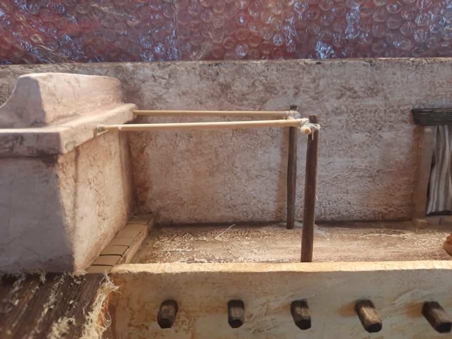 Making a Nativity diorama inside an antique steamer trunk: detailing the balcony above the porch to host the sculptor's canopy