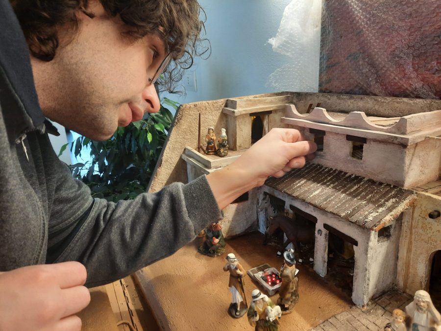 Making a Nativity diorama inside an antique steamer trunk: inserting all the items inside the upper floor bedroom