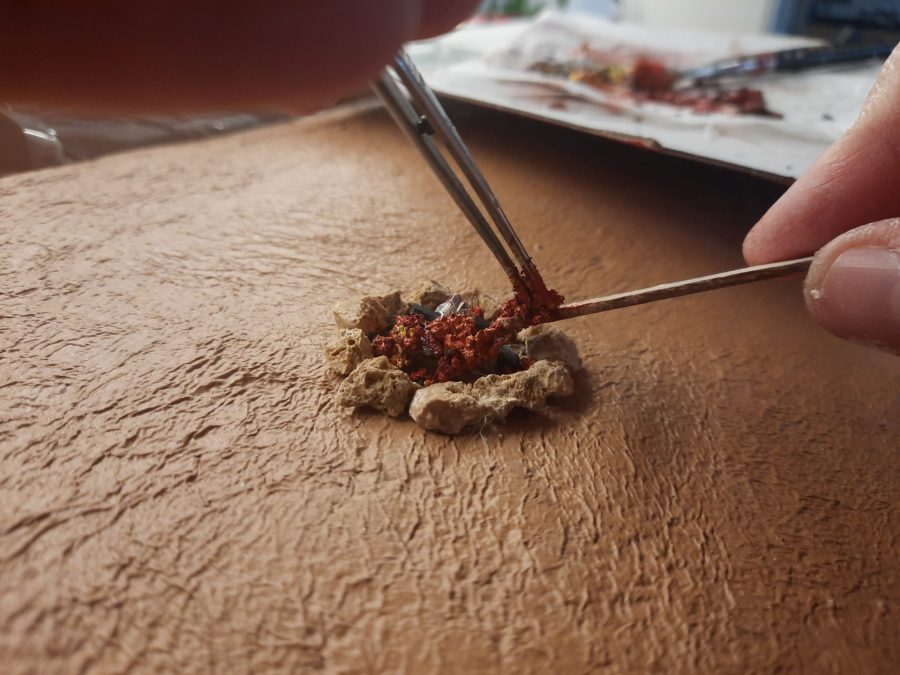 Making a Nativity diorama inside an antique steamer trunk: giving life to the bonfires