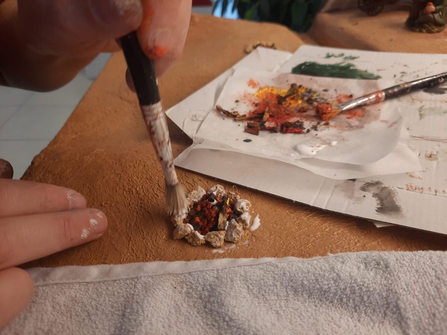 Making a Nativity diorama inside an antique steamer trunk: giving life to the bonfires